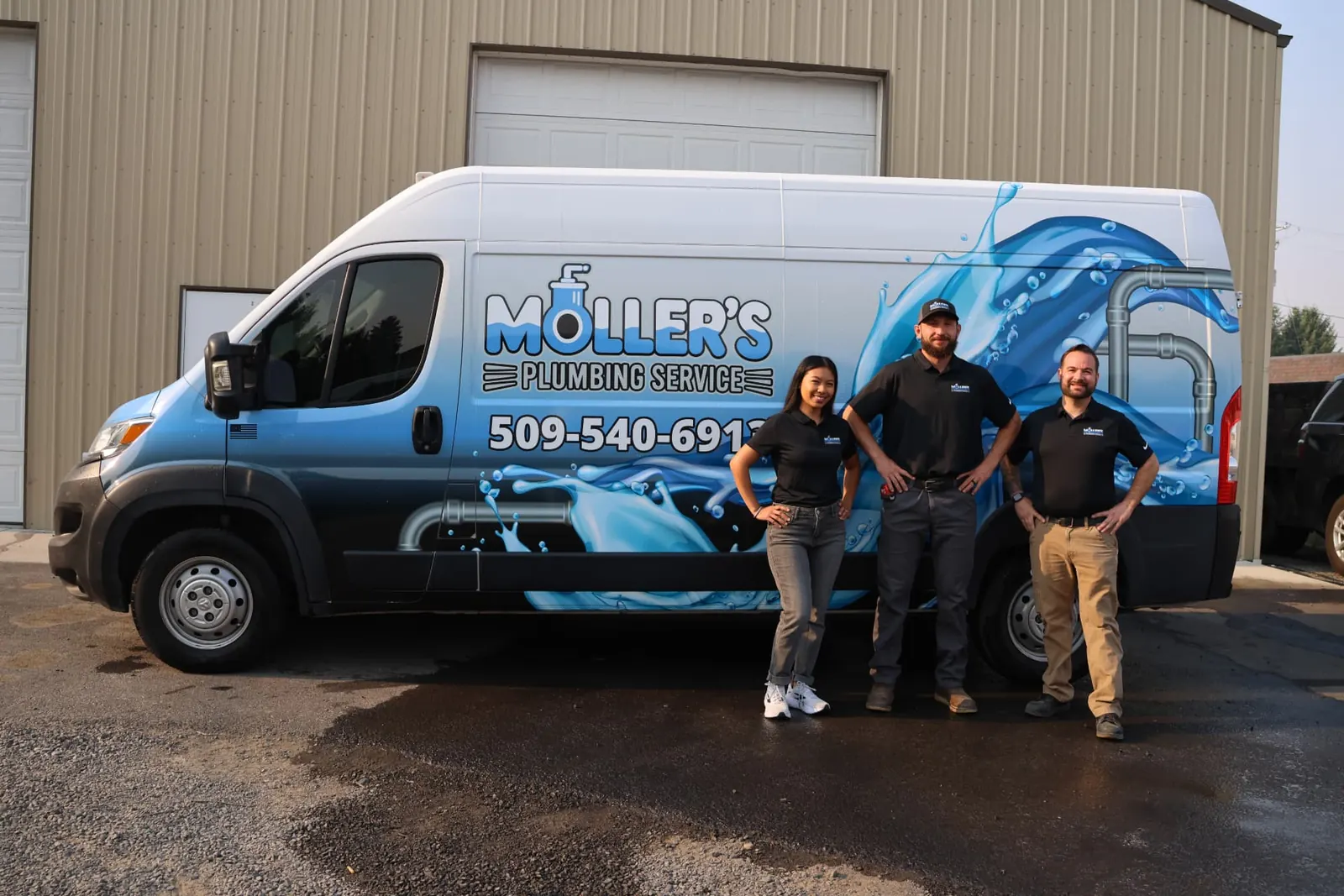 The Moller's Plumbing Service team standing beside their branded service van